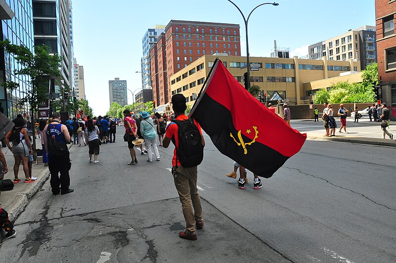 دولة إفريقية تعتزم زيادة أجور الموظفين بنسبة 25% في الربع الأول من 2025 1 Angola Flag Montreal 29524539128 دولة إفريقية تعتزم زيادة أجور الموظفين بنسبة 25% في الربع الأول من 2025